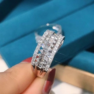 Exquisite silver-plated wide band ring featuring layered baguette and round cut diamonds