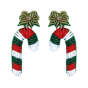 Detail of handmade beaded candy cane earrings with red, green and white Christmas patterns