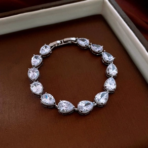 Detail shot of shimmering pear-cut cubic zirconia and silver-plated metal clasp on the bracelet
