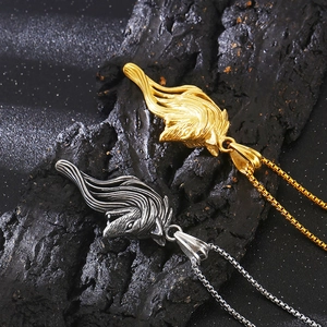 Detail of Viking wolf head pendants in gold and silver finish with elegant box chains