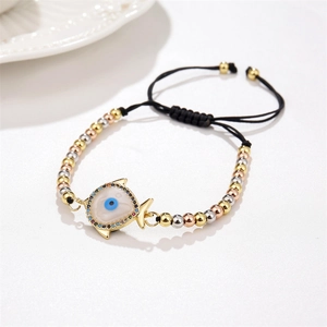 Macro detail of adjustable evil eye fish charm bracelet with micro-pave cubic zirconia