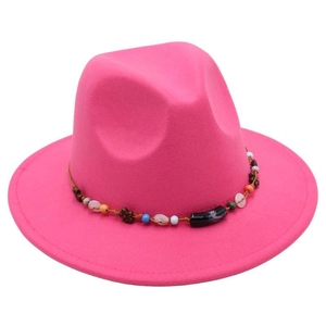 Detail view of pink wool fedora hat with ethnic beaded band and gemstone decor