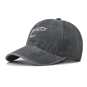 Close-up of vintage washed dark gray baseball cap with white fish hook embroidery detail