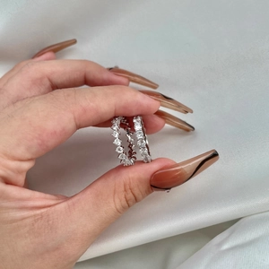 Detailed macro view of S925 sterling silver eternity rings with sparkling zircon stones