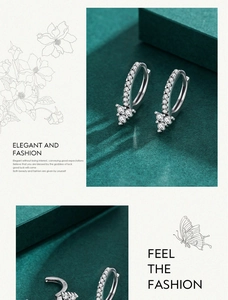 Detail of 925 sterling silver geometric earrings with sparkling triangle zircon stones