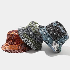 Detailed view of colorful bohemian patchwork bucket hats with intricate stitching and floral patterns