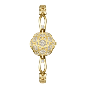 Detailed macro view of gold camellia bracelet watch featuring luxury diamond settings