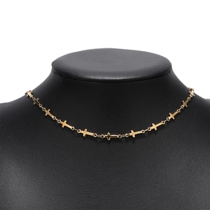 Detail view of 5mm gold stainless steel cross link chain displayed on a black bust mannequin