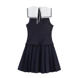 Navy blue sleeveless sailor dress with white collar, pleated skirt and back tie detail