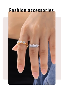 Detailed close-up of gold and silver plated rings with three zircon stone settings