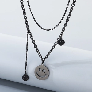 Detail of double-layer silver smile necklace with large and small emoji pendants