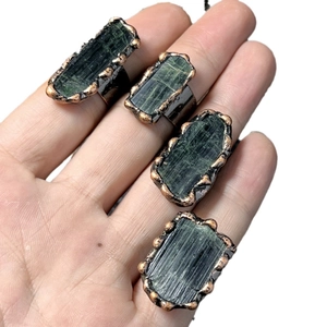 Vintage bronze adjustable ring set with raw green tourmaline stones in unique shapes