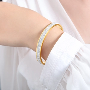Elegant 18k gold plated stainless steel bangle with sparkling paved white zircons for women