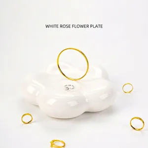 Minimalist white ceramic flower shaped jewelry tray for ring storage and decor