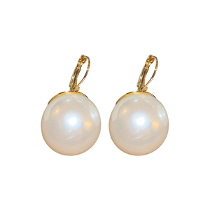 Elegant gold hoop earrings with large lustrous white pearls on a clean white background