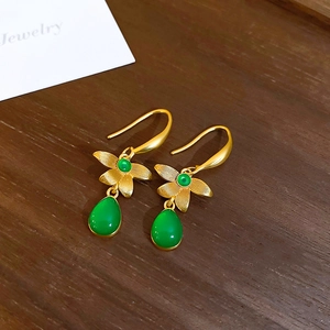 Vintage floral resin drop earrings with matte gold finish and emerald green gemstones