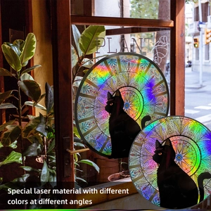 Detail of holographic black cat wall sticker showing rainbow laser effect on glass