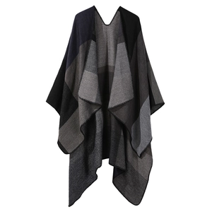 Double-sided plaid knit poncho shawl with black and grey check pattern and overlock edges