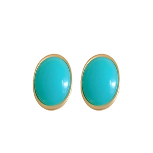 Vintage oval turquoise resin stud earrings with elegant gold-tone metallic edges