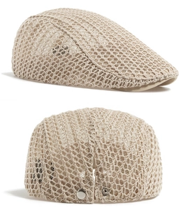 Close-up of beige summer beret showing breathable mesh fabric and metal back buckle