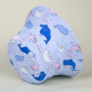 Detail of light blue bucket hat with cartoon whales and swimming time print