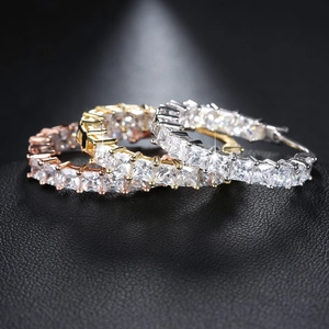 Luxury copper plated gold hoop earrings set with pavé square-cut cubic zirconia crystals