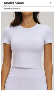 Close-up of romantic purple ribbed yoga top with slim fit and cropped waist design