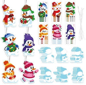 Detail of DIY Christmas snowman sticker set with hanging tags and colorful craft accessories