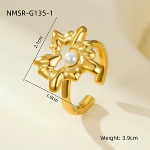 Detailed view of a gold floral open ring with white pearl and 2.1cm dimension marking