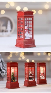 Detailed view of red Christmas telephone booth lanterns with snowman and Santa scenery