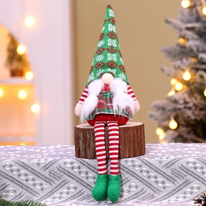 Close-up of a long-legged Christmas gnome doll with striped legs on a rustic wooden base