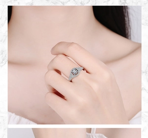 Close-up of model wearing a silver square zirconia ring with diamond accents