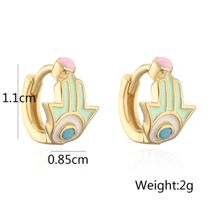 Detailed view of gold Hamsa hand hoop earrings with mint enamel showing 1.1cm dimensions