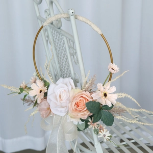 Bridal flower hoop bouquet with white roses and champagne daisies on golden metal ring