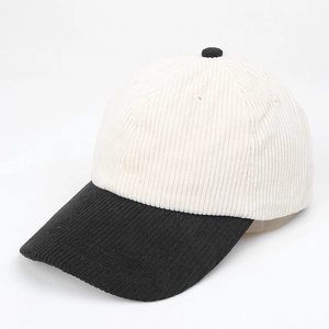 Detail view of corduroy texture on black and white contrast baseball cap fabric