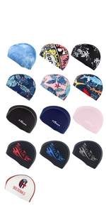 Detailed collection of assorted polyester swim caps with tie-dye and graphic prints