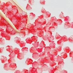 Detailed view of pink gradient lily of the valley glass beads for DIY jewelry making