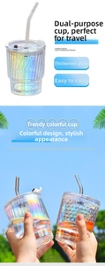 Detail of colorful glass tumblers with ribbed and honeycomb textures and clear straws