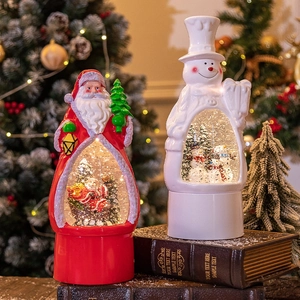 Christmas snow globe lanterns featuring Santa and snowman figures for holiday decor