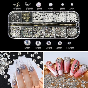 Detail of aurora butterfly nail charms with various sizes and pearls in storage box
