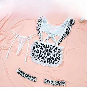 Macro detail of sexy cow print lingerie set with white ruffles and lace trim apron
