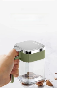 Detail of thickened soda-lime glass seasoning jar with ergonomic handle and silver lid