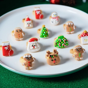 Christmas cartoon ring set with Santa, reindeer, and gingerbread man icons for holidays