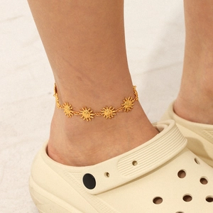 Minimalist 18K gold plated stainless steel sun anklet displayed on a model's ankle