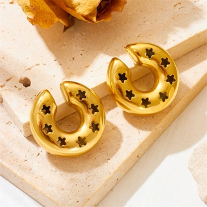 Polished gold stainless steel hoop earrings featuring star hollow-out patterns on a stone background