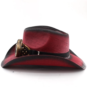 Detail of red cowboy hat with steampunk goggles and spikes in a vintage western style