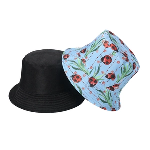 Cartoon ladybug printed and solid black reversible fisherman bucket hat for women