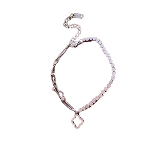 Elegant stainless steel double-layer bracelet featuring a hollow flower clover pendant