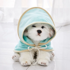 Detail of light blue microfiber pet bathrobe with soft plush texture and bow tie for small dogs