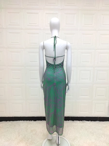Detail of green and purple wave zebra print on a halter backless bodycon mesh midi dress